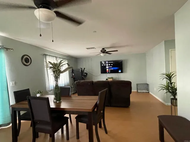 a view of a dining room with furniture