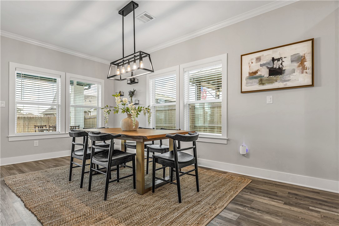 2905 GOLDBERG Drive Bryan, TX 77808 - Photo 11 of 31 a view of a dining room with furniture window and wooden floor