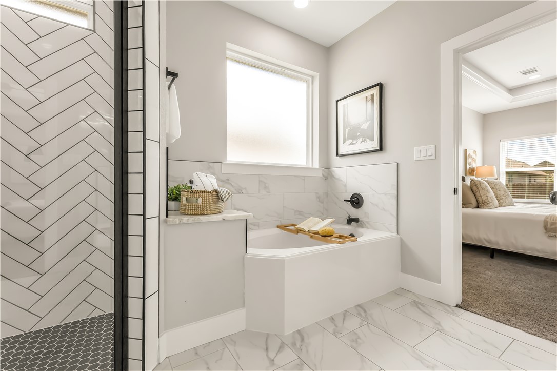 2905 GOLDBERG Drive Bryan, TX 77808 - Photo 20 of 31 a bathroom with a sink toilet and tub