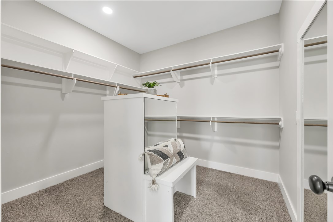 2905 GOLDBERG Drive Bryan, TX 77808 - Photo 23 of 31 a view of walk in closet with empty racks