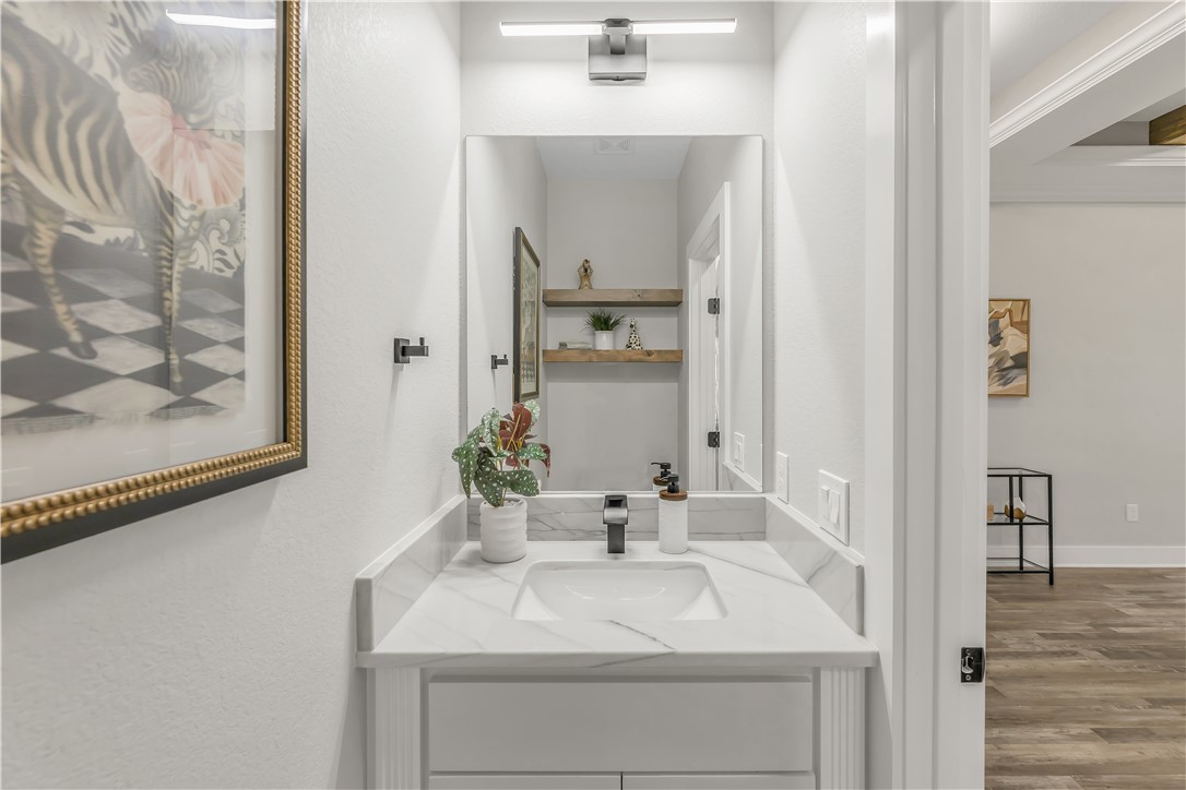 2905 GOLDBERG Drive Bryan, TX 77808 - Photo 27 of 31 a bathroom with a sink and a mirror