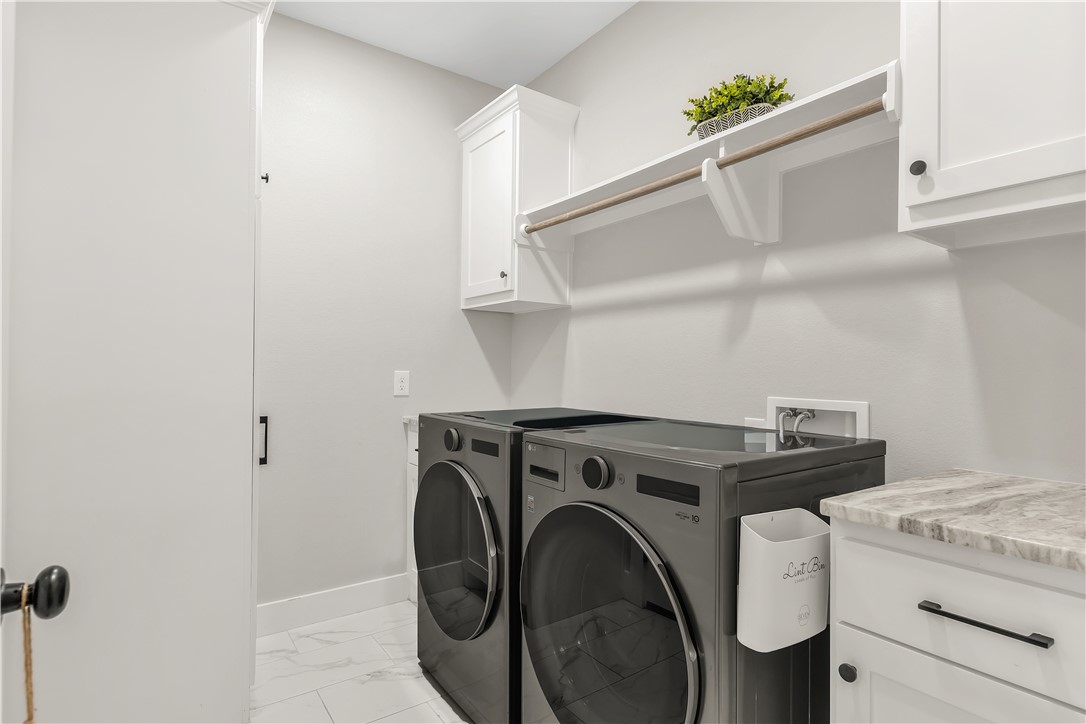 2905 GOLDBERG Drive Bryan, TX 77808 - Photo 29 of 31 a utility room with dryer and washer