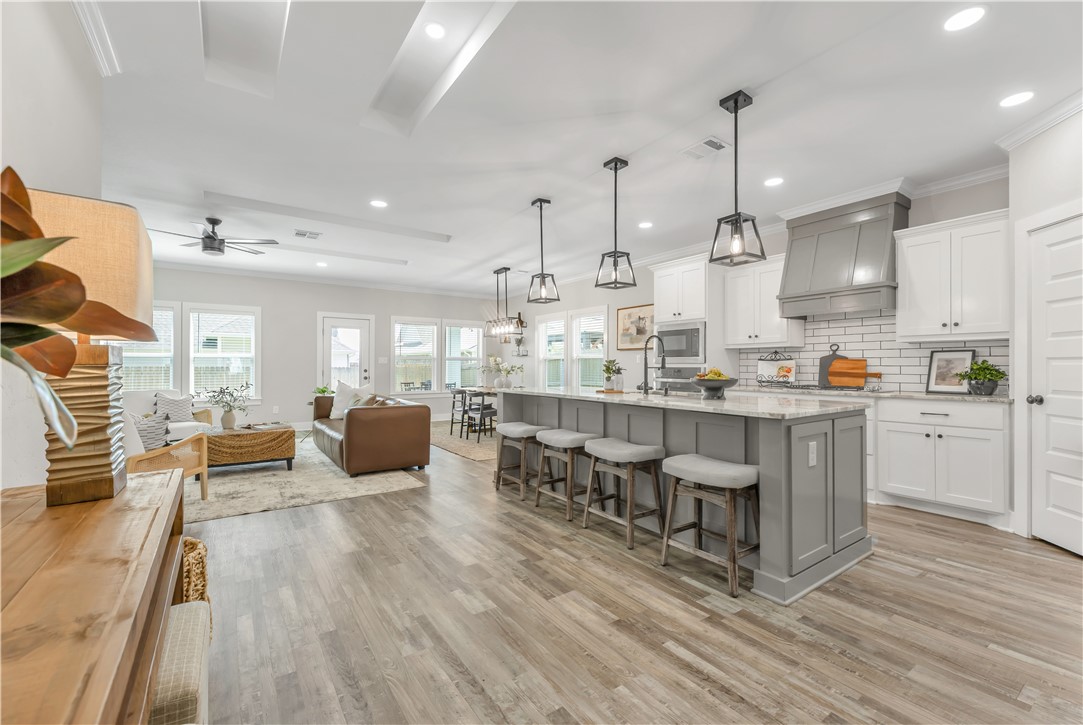 2905 GOLDBERG Drive Bryan, TX 77808 - Photo 6 of 31 a large kitchen with lots of counter space and windows
