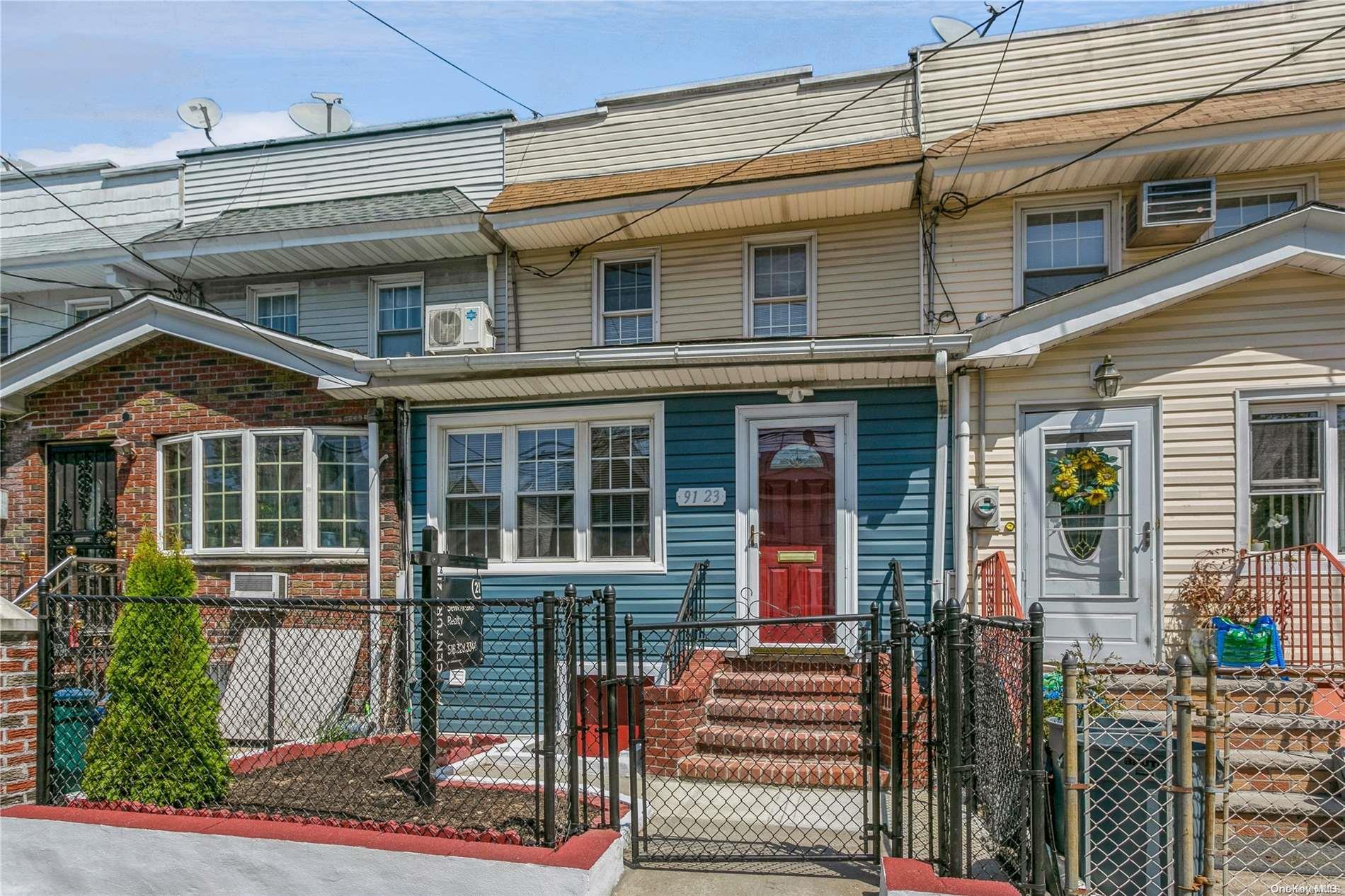 front view of a house with a small yard