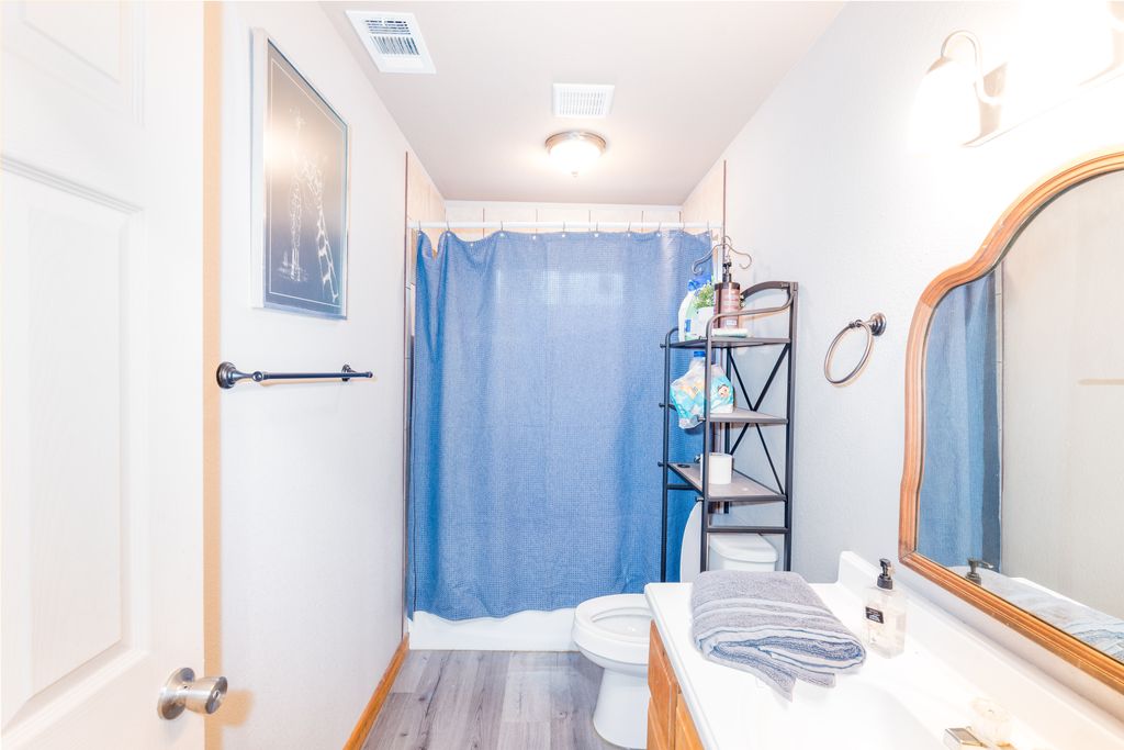 14801 Cedar Valley Road Salado, TX 76571 - Photo 15 of 16 a view of entryway and hall with wooden floor