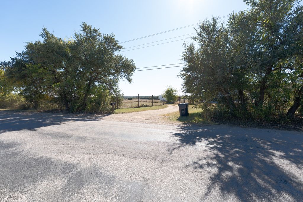14801 Cedar Valley Road Salado, TX 76571 - Photo 16 of 16 a view of street with large trees
