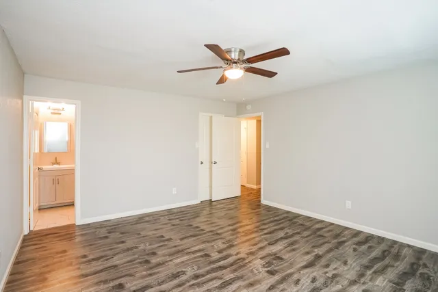 a bathroom with a sink toilet a mirror and shower