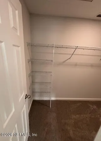 a view of a room with racks on the wall