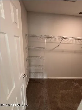 a view of a room with racks on the wall