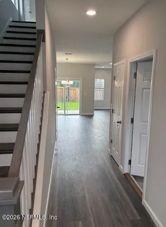 a view of entryway with wooden floor
