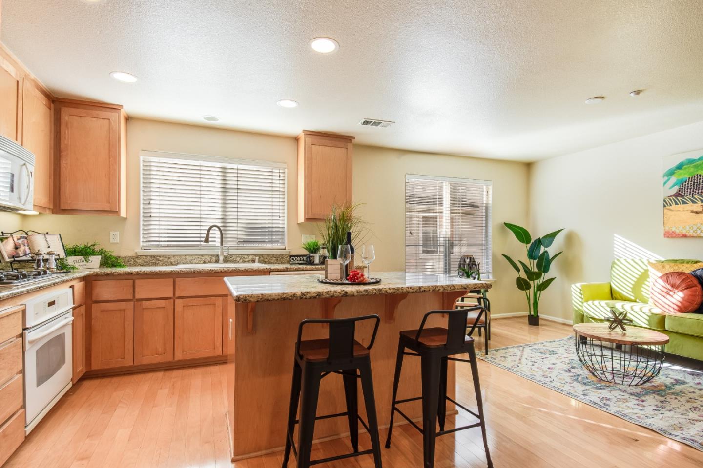 255 Vista Roma Way San Jose, CA 95136 - Photo 11 of 29 a kitchen with granite countertop sink window and stainless steel appliances