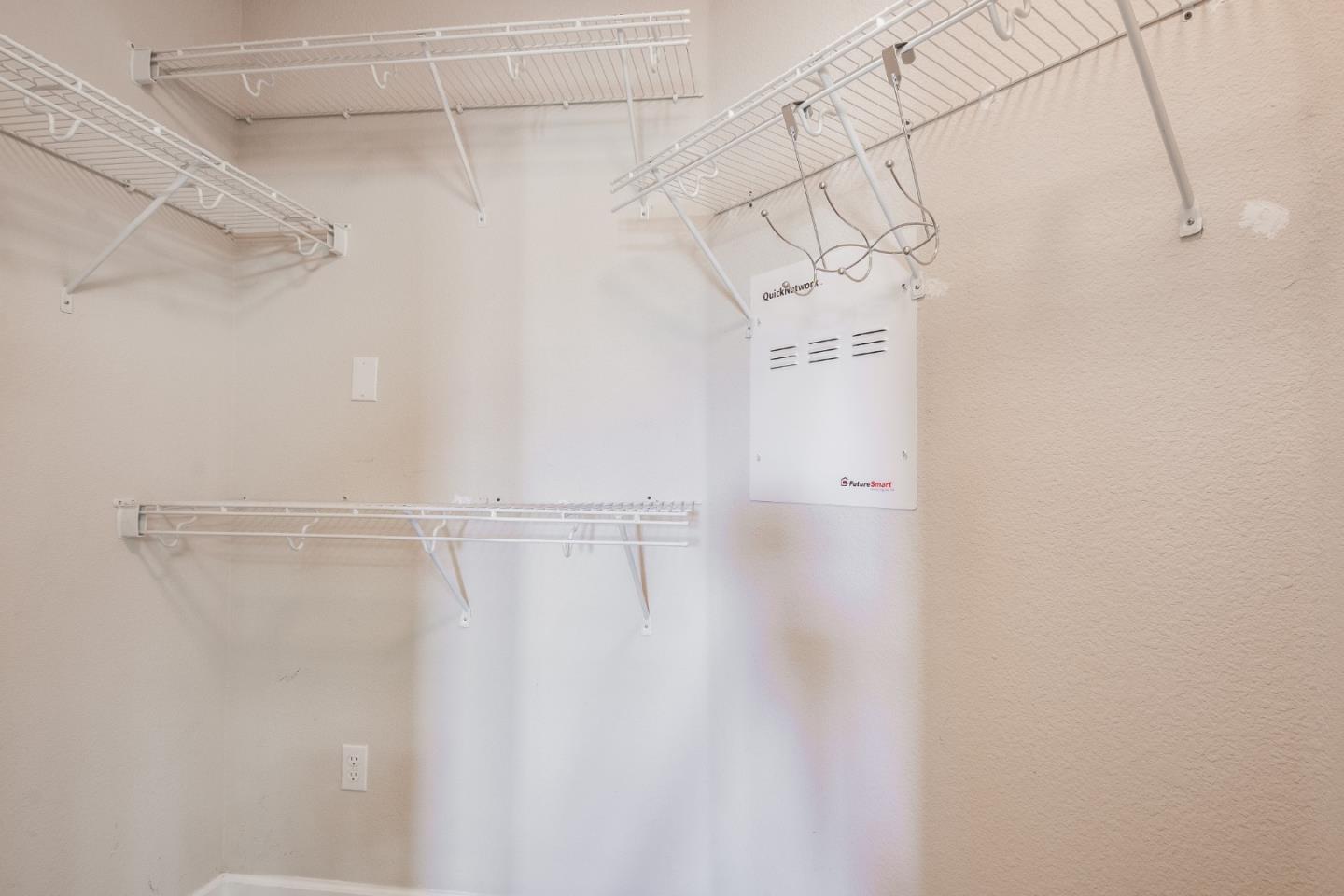 255 Vista Roma Way San Jose, CA 95136 - Photo 19 of 29 a view of a room with racks on the wall