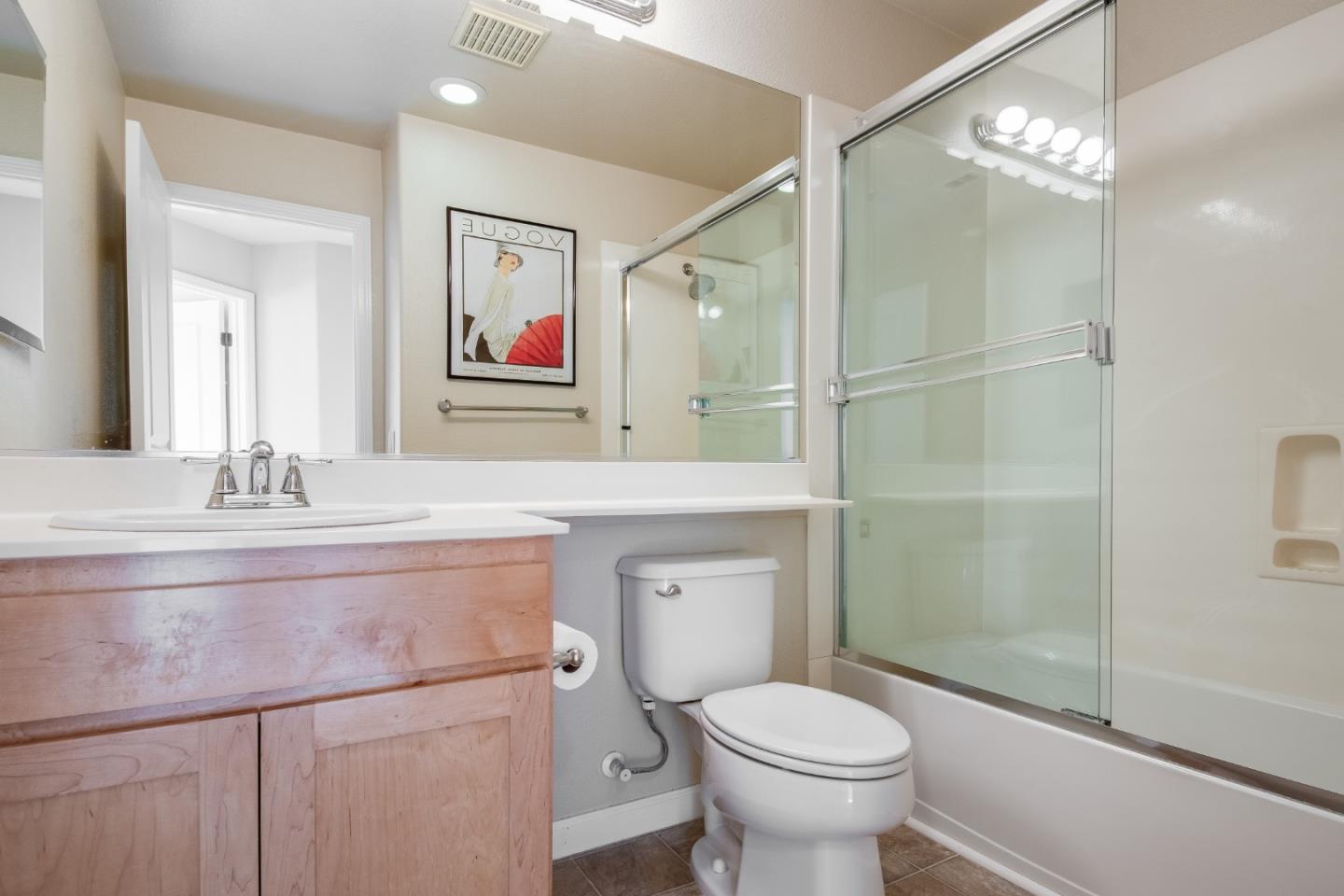 255 Vista Roma Way San Jose, CA 95136 - Photo 22 of 29 a bathroom with a toilet sink and mirror