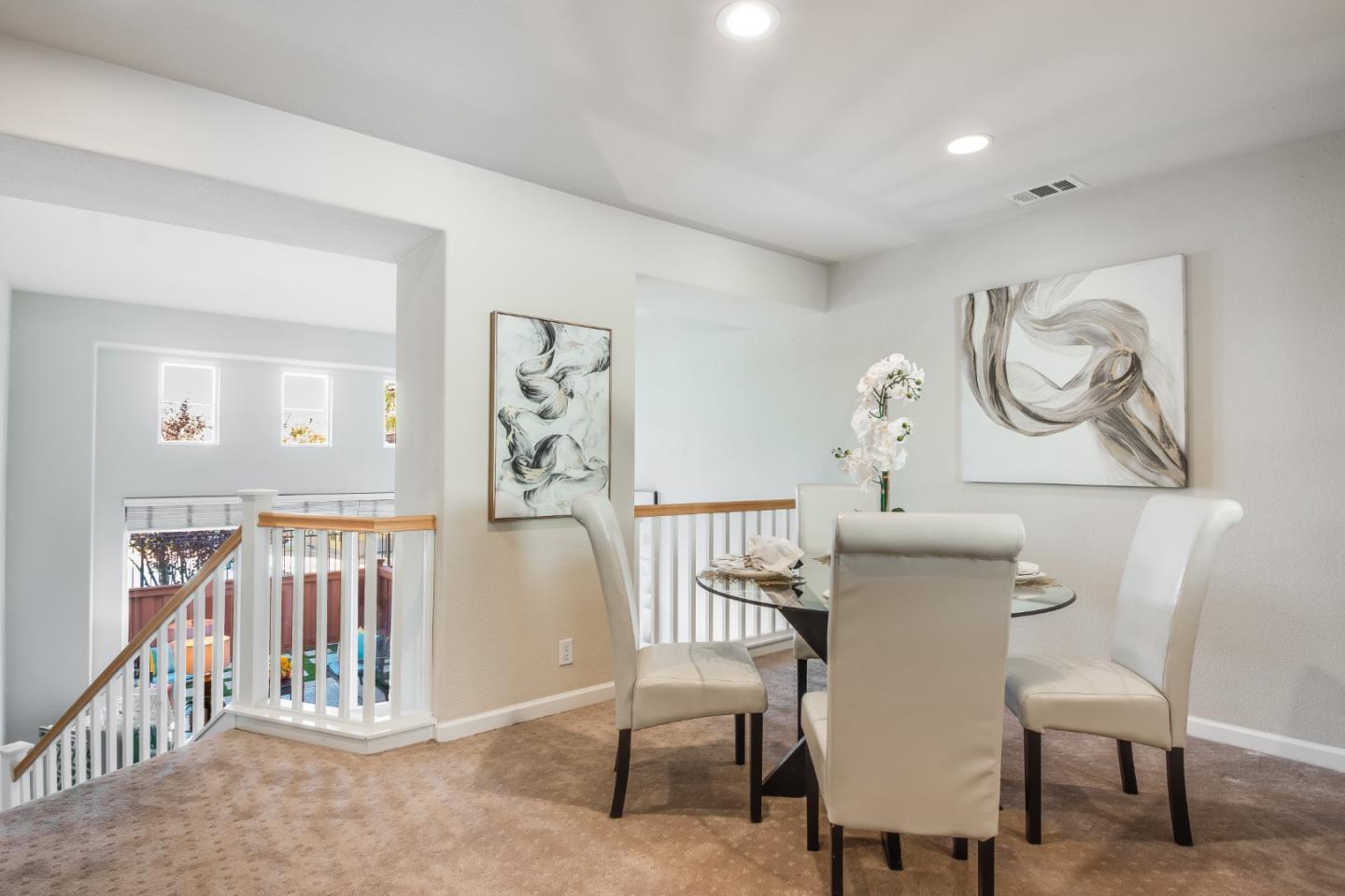 255 Vista Roma Way San Jose, CA 95136 - Photo 9 of 29 a view of a dining room with furniture