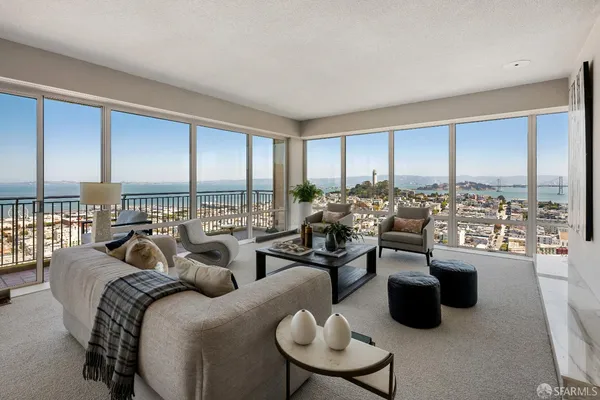 a very nice looking living room with furniture and a large window