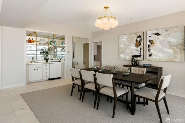 a kitchen with a table chairs and a stove