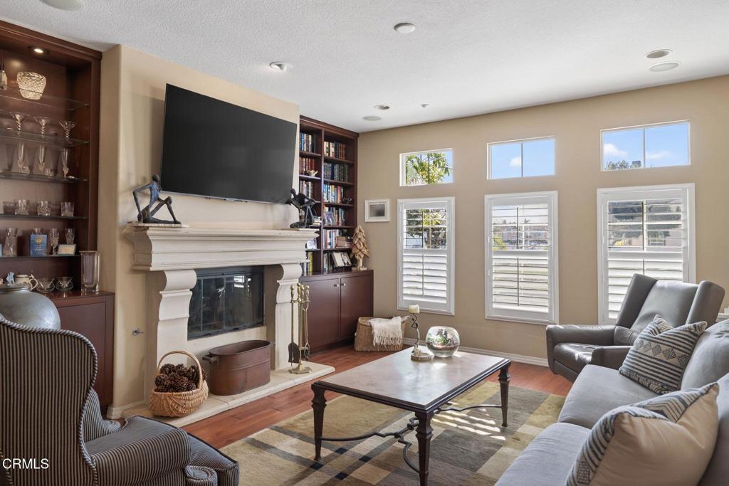 4337 Admiral Way Oxnard, CA 93035 - Photo 11 of 67 a living room with furniture a flat screen tv and a fireplace