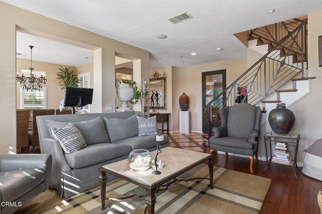 4337 Admiral Way Oxnard, CA 93035 - Photo 12 of 67 a living room with furniture and wooden floor
