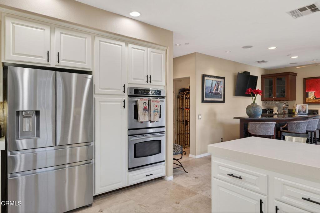 4337 Admiral Way Oxnard, CA 93035 - Photo 18 of 67 a kitchen with stainless steel appliances a refrigerator sink and cabinets