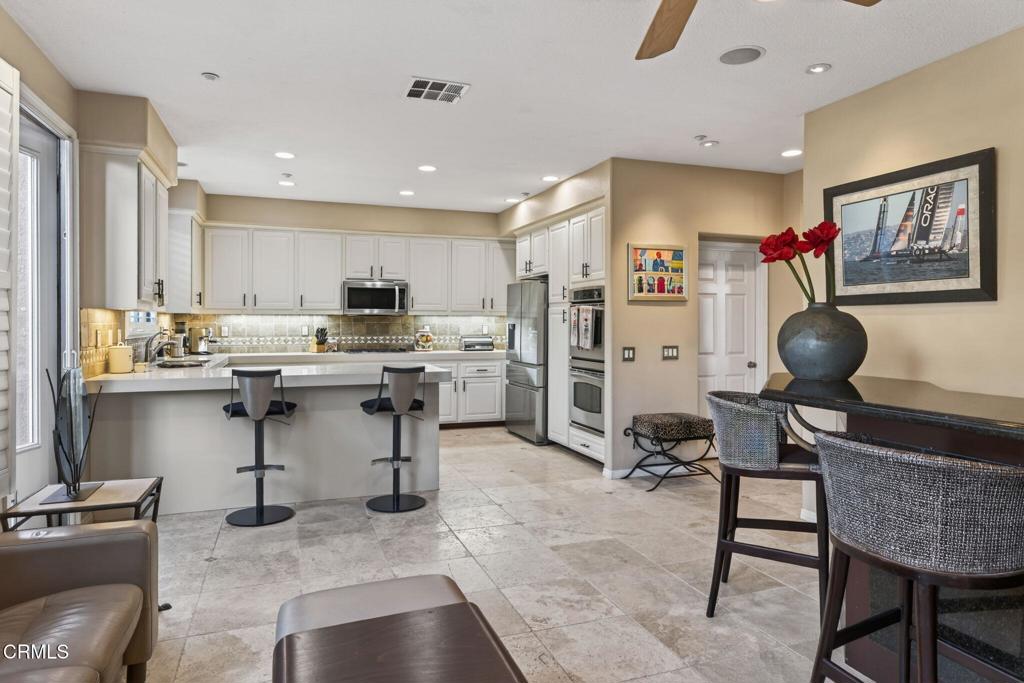 4337 Admiral Way Oxnard, CA 93035 - Photo 23 of 67 a workspace with furniture and kitchen view