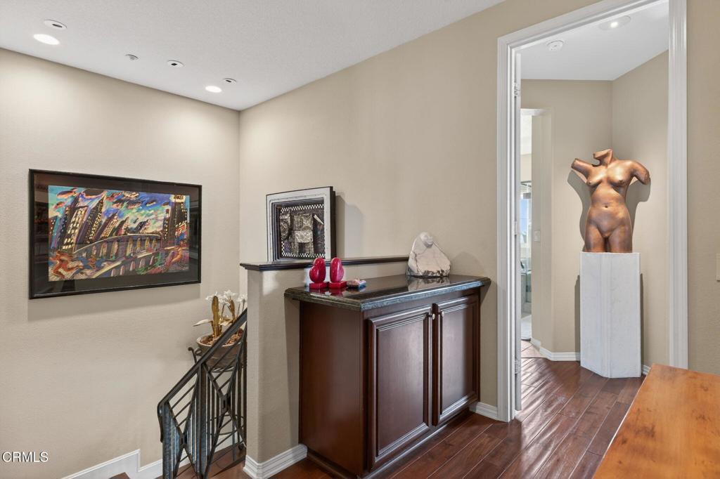 4337 Admiral Way Oxnard, CA 93035 - Photo 25 of 67 a view of a workspace with furniture and wooden floor