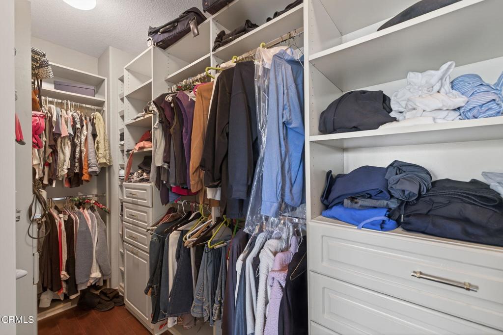 4337 Admiral Way Oxnard, CA 93035 - Photo 39 of 67 a view of walk in closet with clothes and shoes