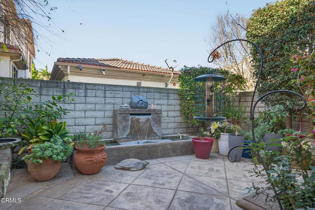 4337 Admiral Way Oxnard, CA 93035 - Photo 48 of 67 a view of a patio with couple of chairs and a potted plant