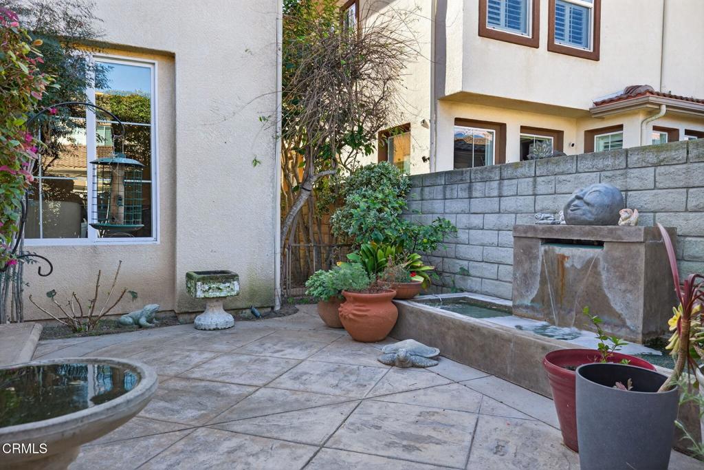 4337 Admiral Way Oxnard, CA 93035 - Photo 50 of 67 a view of a backyard with table and chairs potted plants