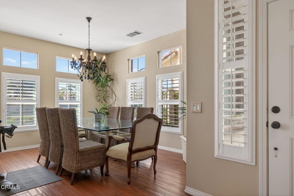 4337 Admiral Way Oxnard, CA 93035 - Photo 8 of 67 a view of a dining room with furniture window and wooden floor