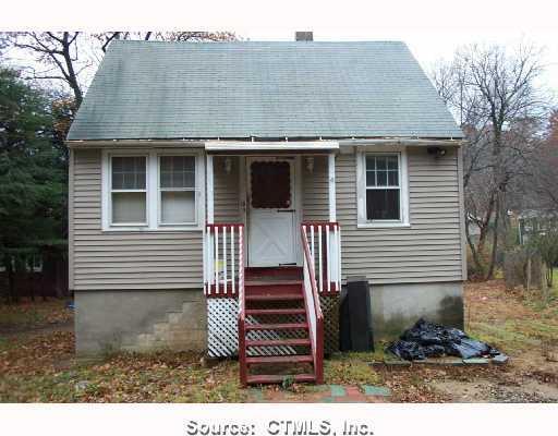 13 Scovill Road Wolcott, CT 06716 - Photo 1 of 1 a front view of a house with a yard