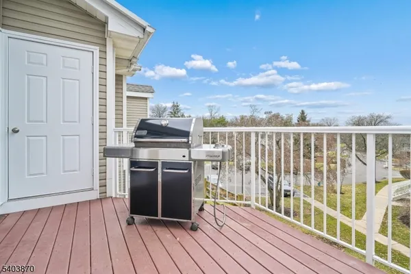 a view of a balcony with wooden floor