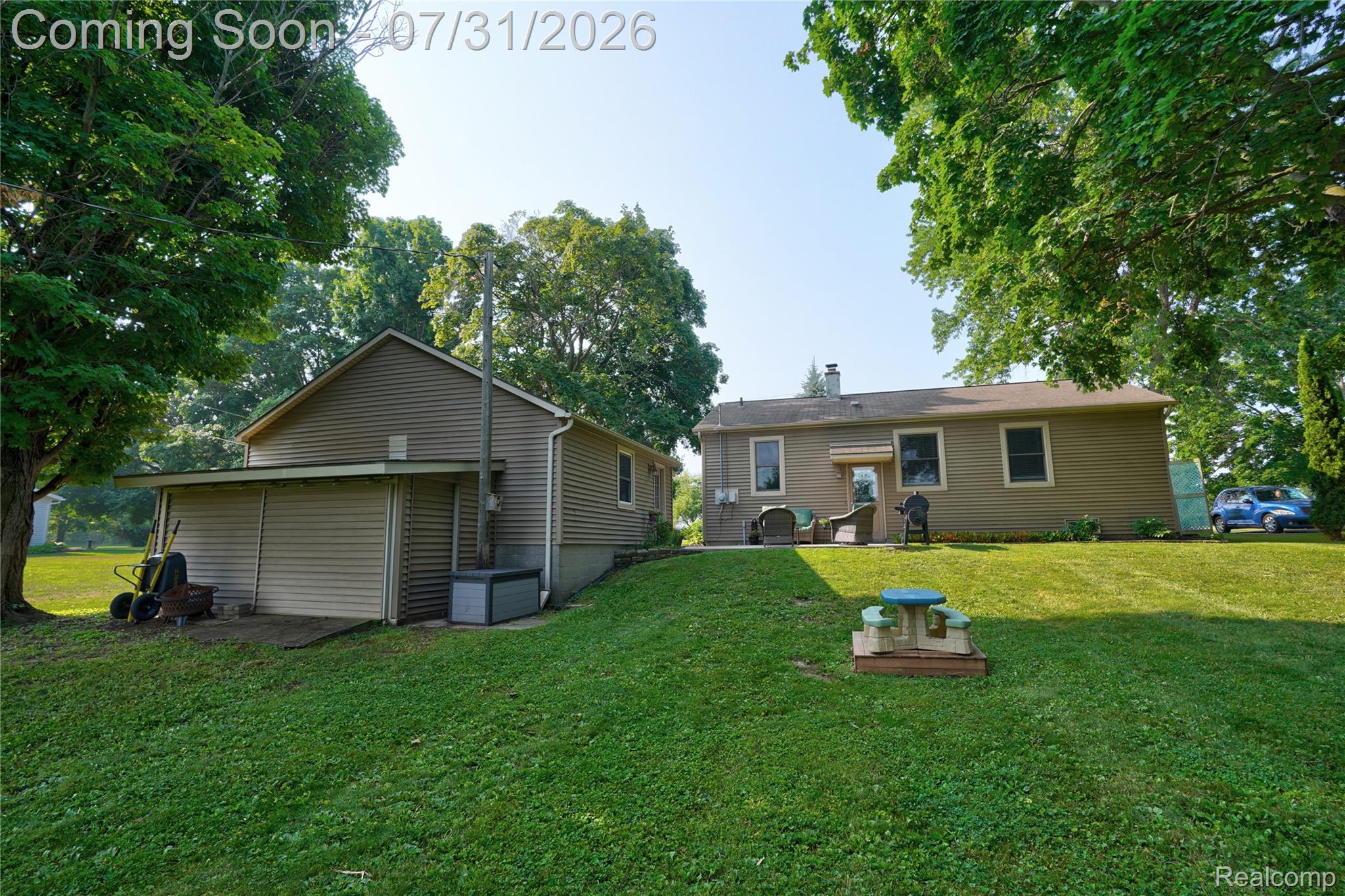 5271 West Main Street Dryden, MI 48428 - Photo 5 of 34 Expansive green lawn with a gentle slope