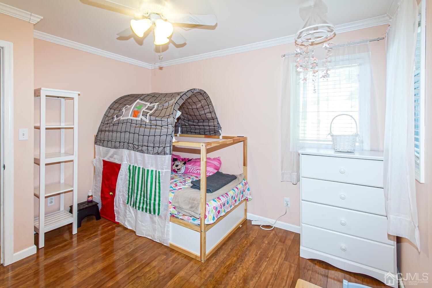 29 Ashley Road Edison, NJ 08817 - Photo 20 of 30 a bedroom with furniture and a window