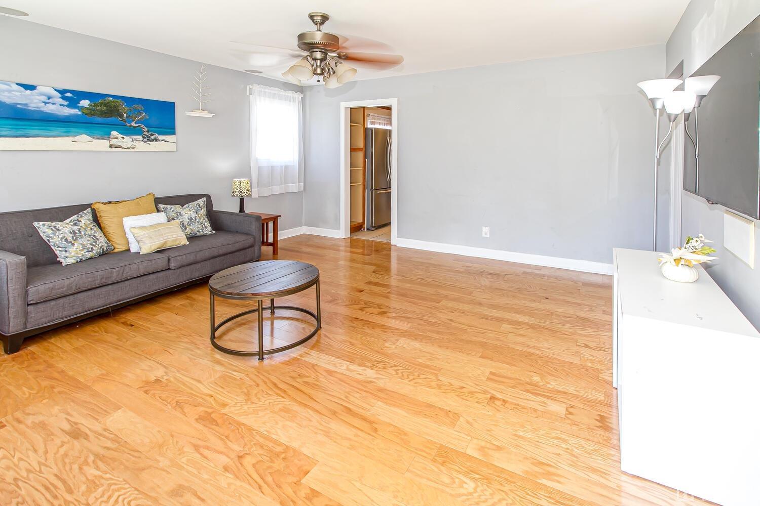 29 Ashley Road Edison, NJ 08817 - Photo 3 of 30 a living room with furniture and a chandelier