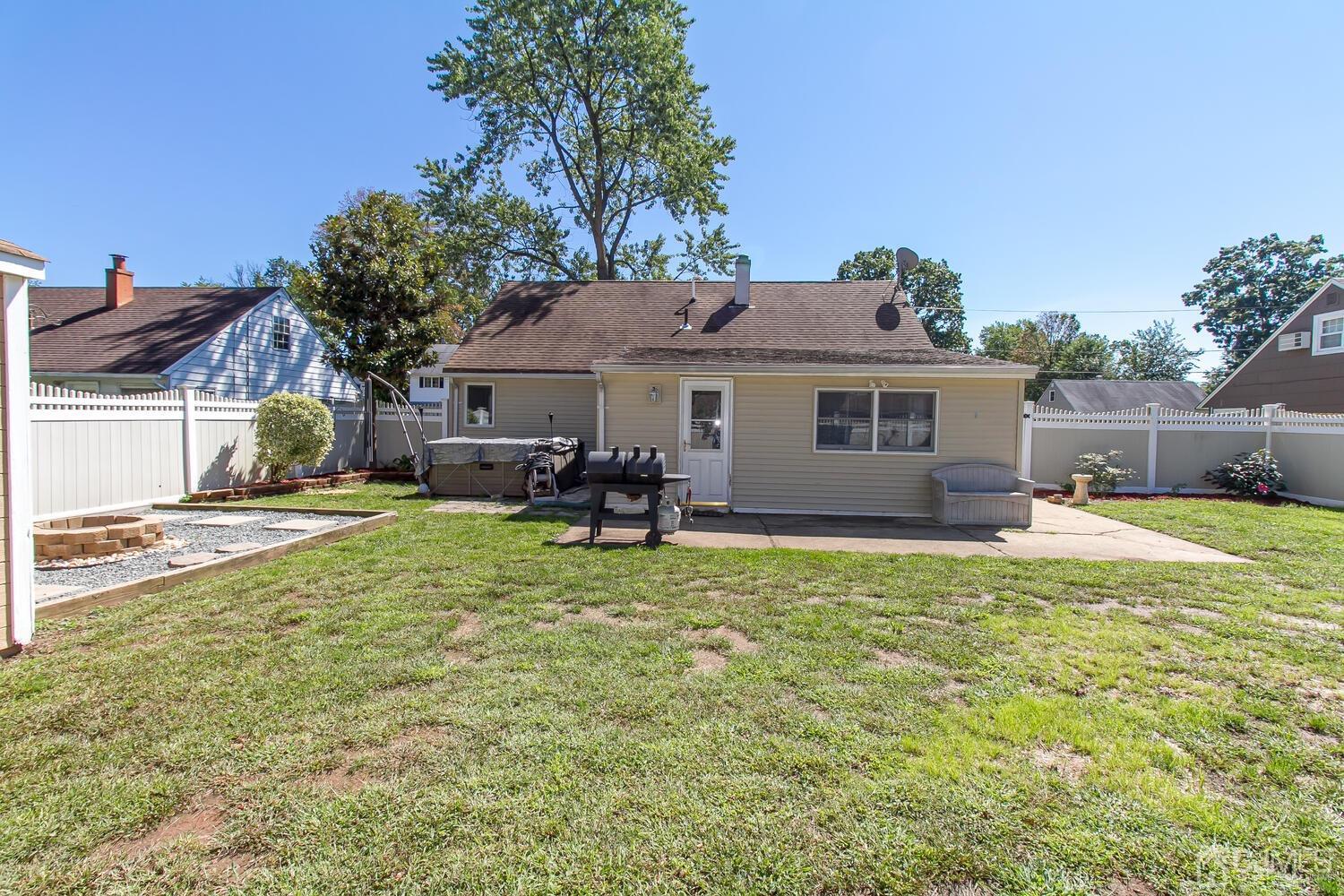 29 Ashley Road Edison, NJ 08817 - Photo 28 of 30 a house view with a sitting space and garden