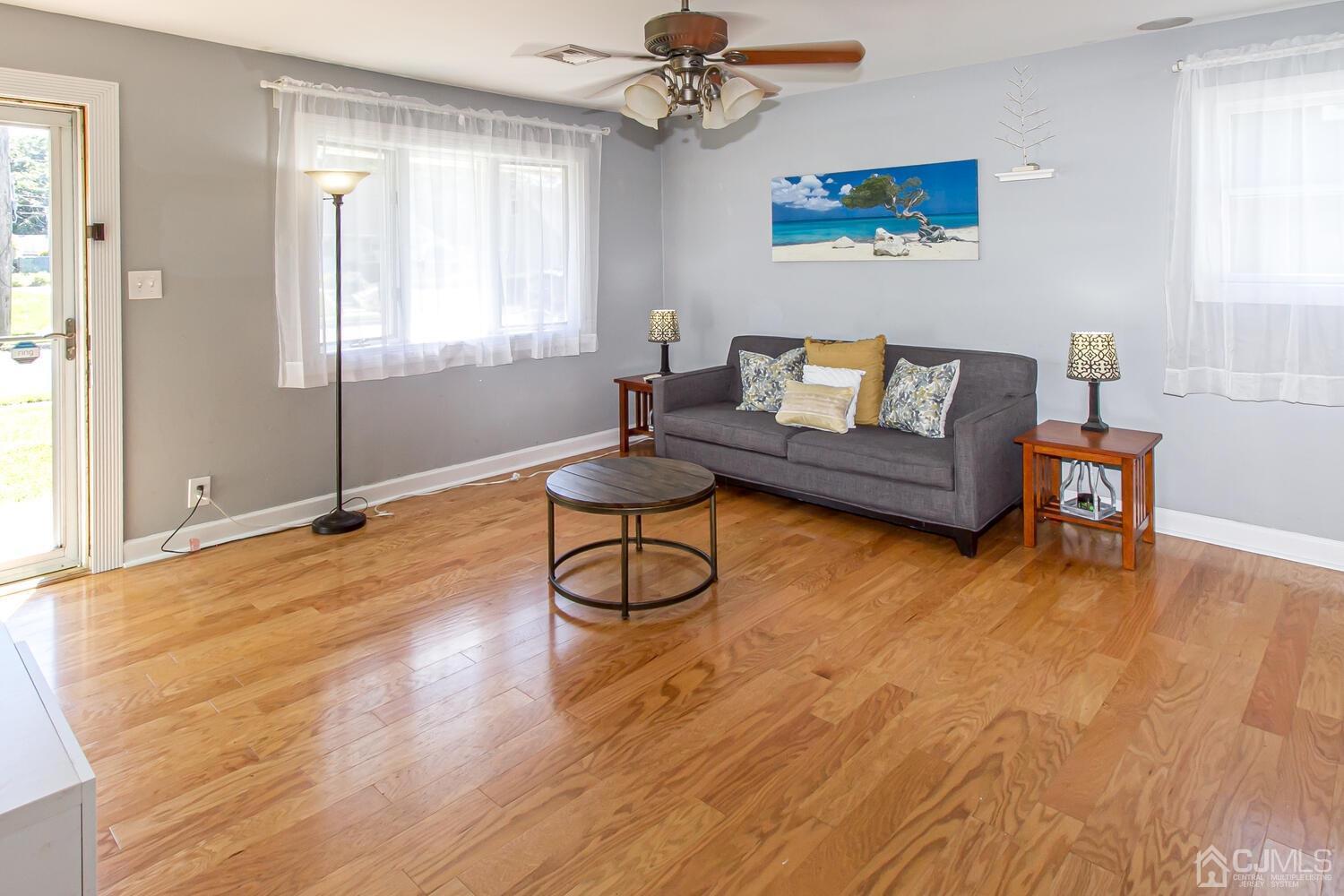 29 Ashley Road Edison, NJ 08817 - Photo 4 of 30 a living room with furniture and a wooden floor