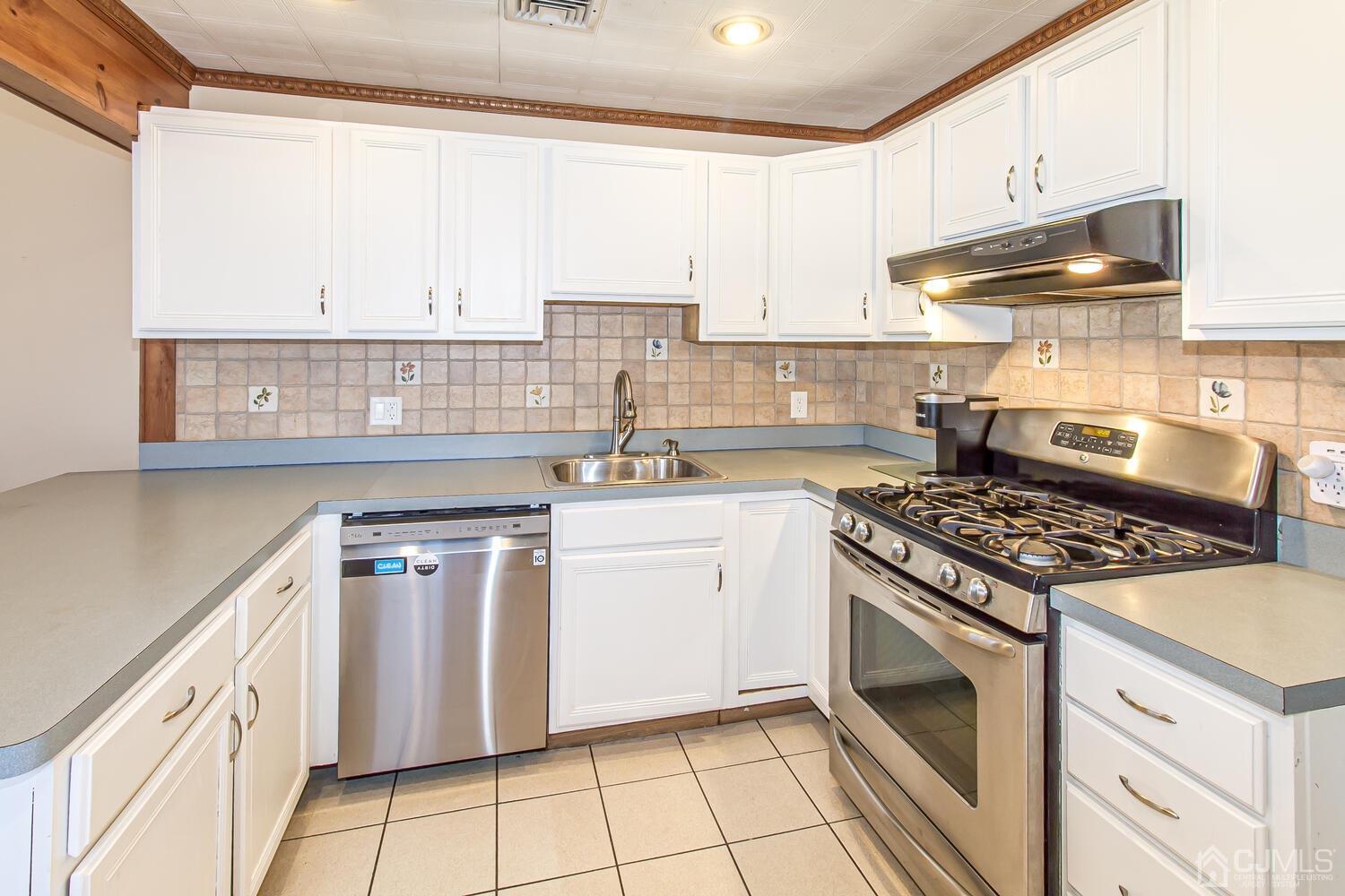 29 Ashley Road Edison, NJ 08817 - Photo 9 of 30 a kitchen with granite countertop cabinets stainless steel appliances and a sink