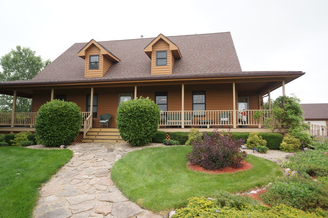 8101 West Bruns Road Monee, IL 60449 - Photo 1 of 25 a front view of a house with a yard