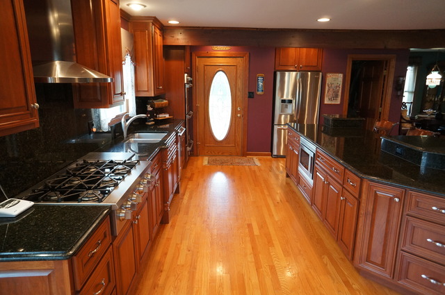 8101 West Bruns Road Monee, IL 60449 - Photo 8 of 25 a kitchen with counter top space a sink and cabinets