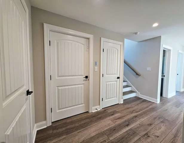 wooden floor with white walls