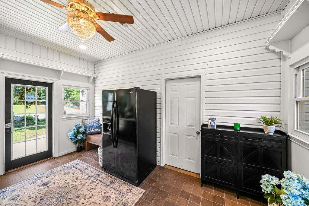 7 College View Drive Southwest Rome, GA 30161 - Photo 34 of 49 a living room with a black wooden floor and a potted plant