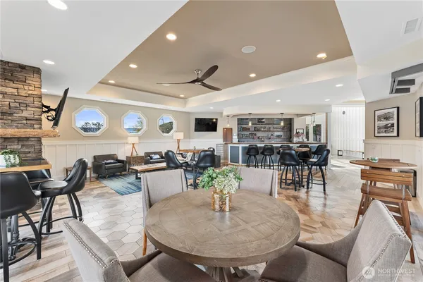 a living room with lots of furniture and view of kitchen