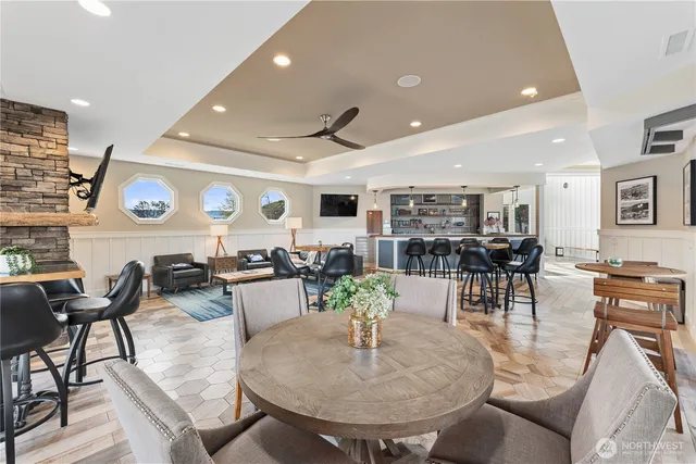 a living room with lots of furniture and view of kitchen