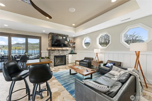 a living room with fireplace furniture and a flat screen tv