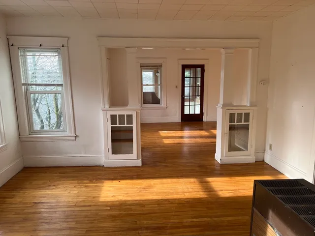 a view of a kitchen with a sink and microwave
