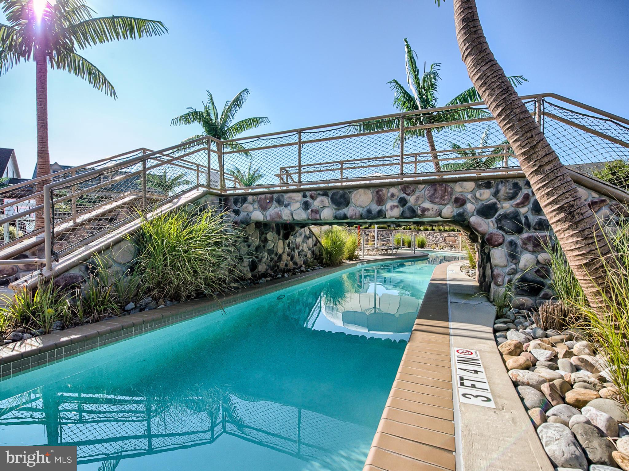 8910 Shady Pines Drive Frederick, MD 21704 - Photo 16 of 22 a view of swimming pool with a garden and seating area