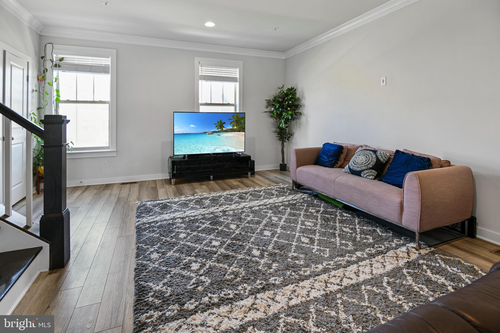 8910 Shady Pines Drive Frederick, MD 21704 - Photo 2 of 22 a living room with furniture and a flat screen tv
