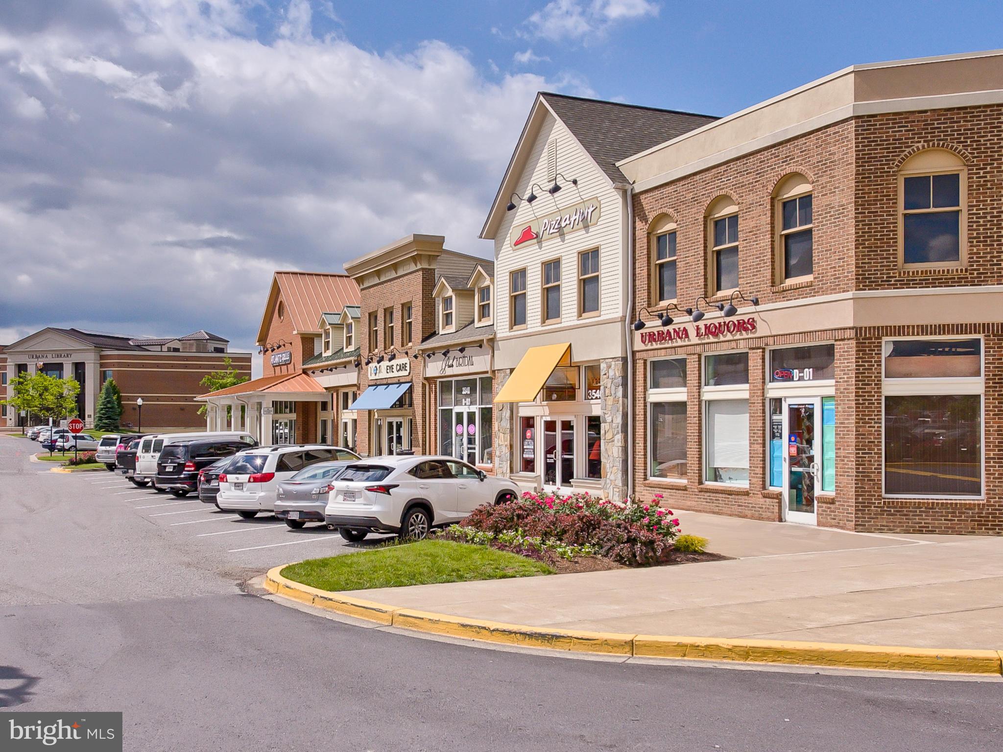 8910 Shady Pines Drive Frederick, MD 21704 - Photo 22 of 22 a front view of a building with cars parked