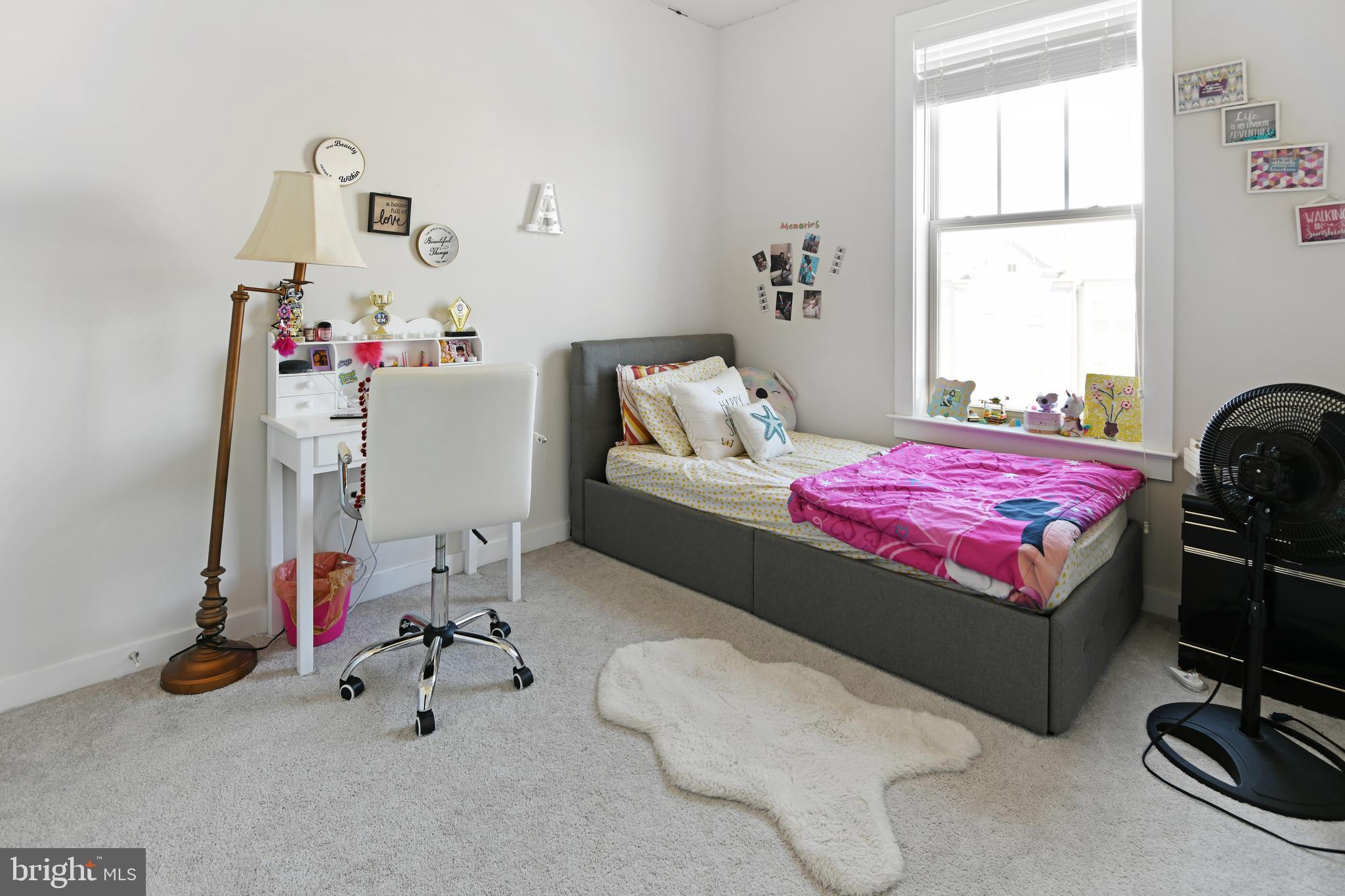 8910 Shady Pines Drive Frederick, MD 21704 - Photo 10 of 22 a bedroom with a bed and a chandelier