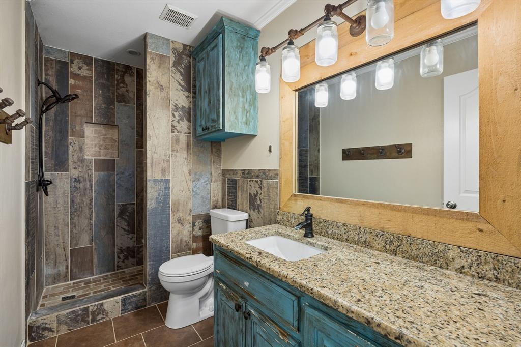 1700 Rock Ridge Road Lucas, TX 75002 - Photo 25 of 37 This bathroom will undergo cosmetic renovation with a neutral palate, new shower tile, vanity, mirror, lighting and paint.